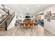 Spacious open-concept floor plan seamlessly connecting the living room and dining area with staircase at 352 Dandelion Brook Ct, Las Vegas, NV 89148