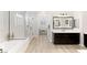 Elegant bathroom featuring a soaking tub, separate glass shower, and dual vanities for a spa-like experience at 352 Dandelion Brook Ct, Las Vegas, NV 89148