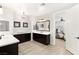Bright, dual vanity primary bathroom featuring seamless transition to bedroom at 352 Dandelion Brook Ct, Las Vegas, NV 89148