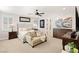 Serene primary bedroom with neutral tones, a seating area, and ample natural light at 352 Dandelion Brook Ct, Las Vegas, NV 89148