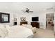 Bright primary bedroom boasts ample space, with calming decor, ceiling fan and furniture at 352 Dandelion Brook Ct, Las Vegas, NV 89148