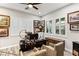 A home office featuring hardwood floors, plantation shutters, two desks and two chairs at 352 Dandelion Brook Ct, Las Vegas, NV 89148