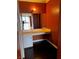 Bathroom vanity area featuring a makeup area and hardwood floors at 3930 University Center Dr # 702, Las Vegas, NV 89119