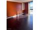 Bedroom with dark hardwood floors, natural light, and large window with great view at 3930 University Center Dr # 702, Las Vegas, NV 89119