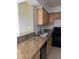 Spacious kitchen featuring light wood cabinets at 3930 University Center Dr # 702, Las Vegas, NV 89119