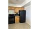 Kitchen view of a refrigerator and stove at 3930 University Center Dr # 702, Las Vegas, NV 89119