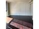 Living area featuring hardwood floors, neutral walls, and sliding glass doors at 3930 University Center Dr # 702, Las Vegas, NV 89119