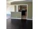 Open floor plan featuring living room with hardwood floors connecting to kitchen at 3930 University Center Dr # 702, Las Vegas, NV 89119