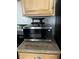 Close up on a microwave with a cabinet overhead at 3930 University Center Dr # 702, Las Vegas, NV 89119