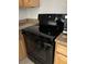 The black oven is positioned next to the marble-look counter at 3930 University Center Dr # 702, Las Vegas, NV 89119