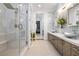 Modern bathroom with glass enclosed shower, double vanity with vessel sinks and sleek design at 4140 Coneflower St, Las Vegas, NV 89135