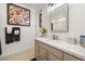 Bathroom featuring a modern sink, vanity, framed artwork, and neutral color palette at 4140 Coneflower St, Las Vegas, NV 89135