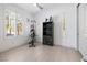 Bright bedroom with plantation shutters, workout equipment, and a stylish display cabinet at 4140 Coneflower St, Las Vegas, NV 89135
