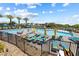 Enjoy the community pool with plenty of lounge chairs and umbrellas for residents to relax at 4140 Coneflower St, Las Vegas, NV 89135