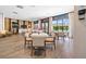 Charming dining area featuring tables, chairs, and large windows providing natural light and community views at 4140 Coneflower St, Las Vegas, NV 89135