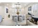 Elegant dining area with modern lighting, stylish chairs, and sophisticated decor, perfect for entertaining at 4140 Coneflower St, Las Vegas, NV 89135