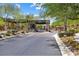 Elegant gated community entrance with lush landscaping and modern design at 4140 Coneflower St, Las Vegas, NV 89135