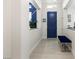 Inviting entryway with blue accent wall and stylish blue door at 4140 Coneflower St, Las Vegas, NV 89135