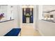 Elegant entryway featuring blue accent wall and modern light fixtures at 4140 Coneflower St, Las Vegas, NV 89135
