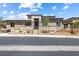 Attractive single-story home showcasing manicured landscaping and a charming stone facade at 4140 Coneflower St, Las Vegas, NV 89135