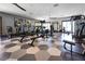 State-of-the-art gym with modern equipment and large windows for a bright workout space at 4140 Coneflower St, Las Vegas, NV 89135
