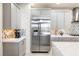 The kitchen features stainless steel appliances and a stylish backsplash at 4140 Coneflower St, Las Vegas, NV 89135