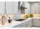 The kitchen showcases modern appliances, stylish backsplash, and sleek cabinetry at 4140 Coneflower St, Las Vegas, NV 89135