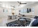 Inviting living space with a cozy sofa, modern lighting, dining area and elegant decor at 4140 Coneflower St, Las Vegas, NV 89135
