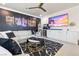 Chic living room with an entertainment center, comfortable seating, and modern decor at 4140 Coneflower St, Las Vegas, NV 89135
