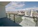 Balcony view of the city with clear glass railings and parking below at 4381 W Flamingo Rd # 3118, Las Vegas, NV 89103