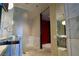 This sleek bathroom features marble accents, a glass shower enclosure, and a modern aesthetic at 4381 W Flamingo Rd # 3118, Las Vegas, NV 89103