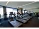 Modern gym featuring rows of treadmills with large windows and city views at 4381 W Flamingo Rd # 3118, Las Vegas, NV 89103