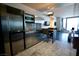 Efficient modern kitchen featuring stainless steel appliances, plus a dining area with bar stools at 4381 W Flamingo Rd # 3118, Las Vegas, NV 89103