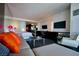 Modern living room featuring an open floor plan, sleek furniture, and flat screen televisions at 4381 W Flamingo Rd # 3118, Las Vegas, NV 89103