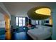 Modern living space showcasing a bed, seating area, desk, and city view at 4381 W Flamingo Rd # 3118, Las Vegas, NV 89103