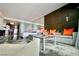 Cozy living room with a plush gray sofa, unique lighting, and a partial view of the kitchen at 4381 W Flamingo Rd # 3616, Las Vegas, NV 89103