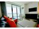 Bright living room featuring a modern entertainment center and city views through sliding glass doors at 4381 W Flamingo Rd # 3616, Las Vegas, NV 89103