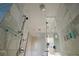 Modern bathroom featuring a glass shower with marble tile, overhead fixture and sleek fixtures at 4381 W Flamingo Rd # 3616, Las Vegas, NV 89103