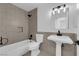 Bathroom features white fixtures and tile flooring at 4508 Rip Van Winkle Ln, Las Vegas, NV 89102