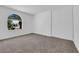 Bedroom with neutral carpet, large window, and wide closet at 4508 Rip Van Winkle Ln, Las Vegas, NV 89102
