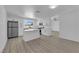 Stylish white kitchen featuring stainless steel appliances and a large island at 4508 Rip Van Winkle Ln, Las Vegas, NV 89102