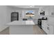 Bright kitchen featuring white cabinets, stainless steel appliances, and a center island with a quartz countertop at 4508 Rip Van Winkle Ln, Las Vegas, NV 89102