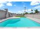 Gorgeous backyard pool with concrete deck, small lawn, and block wall perfect for outdoor enjoyment and privacy at 4508 Rip Van Winkle Ln, Las Vegas, NV 89102