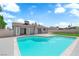 Backyard featuring a sparkling pool, a grass lawn, and the home's exterior with neutral paint at 4508 Rip Van Winkle Ln, Las Vegas, NV 89102