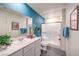 Well-lit bathroom with modern fixtures, stylish vanity, and glass-enclosed shower at 48344 Orchid Ridge Ave # 104, Las Vegas, NV 89141