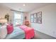 Comfortable bedroom featuring a bright window, stylish decor, and a cozy bed at 48344 Orchid Ridge Ave # 104, Las Vegas, NV 89141