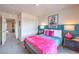 Well-decorated bedroom with a modern aesthetic, vibrant colors, and dual bedside tables at 48344 Orchid Ridge Ave # 104, Las Vegas, NV 89141