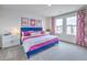 Bright bedroom with stylish decor, comfortable bed and lots of natural light at 48344 Orchid Ridge Ave # 104, Las Vegas, NV 89141