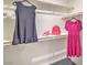 Organized walk-in closet with clothing, shelves, and accessories offering efficient storage solutions at 48344 Orchid Ridge Ave # 104, Las Vegas, NV 89141