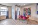 Charming dining area with stylish decor and plenty of natural light from large windows at 48344 Orchid Ridge Ave # 104, Las Vegas, NV 89141